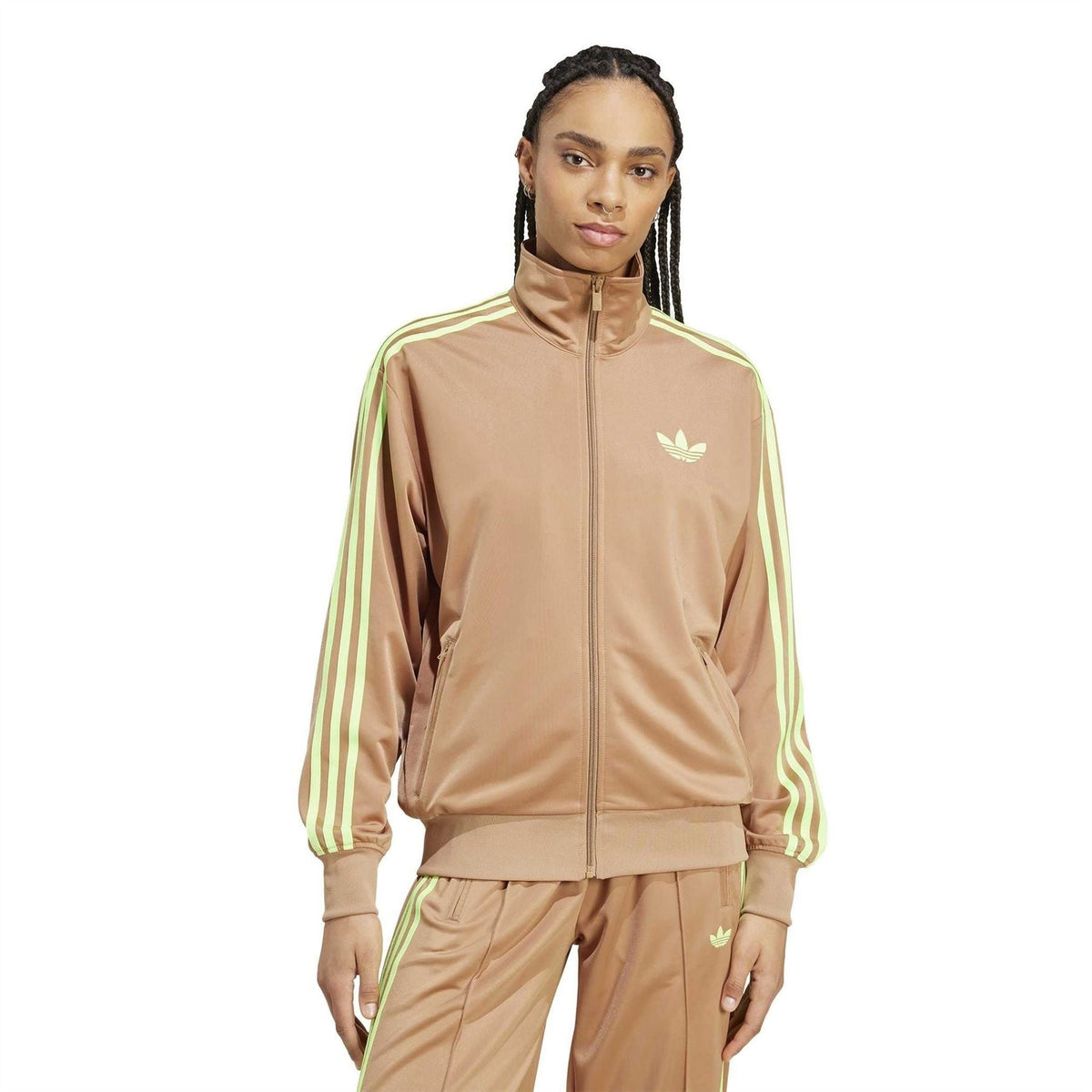 Tan track jacket with full zip, stand collar, chest trefoil logo, and neon stripe sleeves