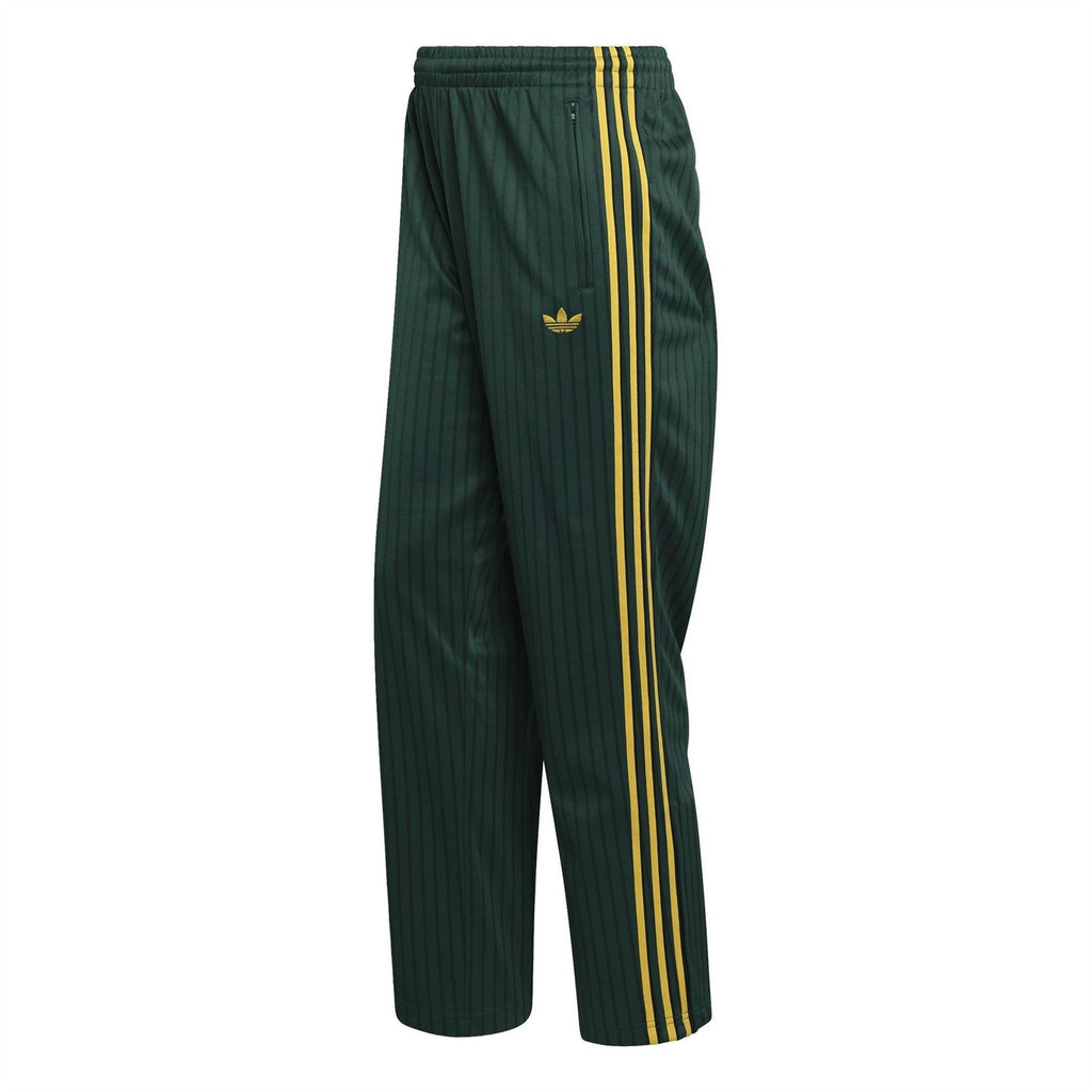 Adidas Originals Firebird track pants in dark green with yellow side stripes