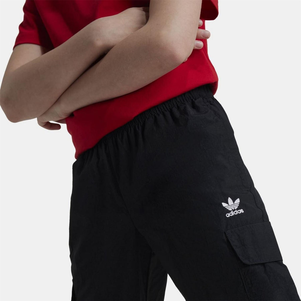 Black cargo track pants with adidas trefoil logo on thigh and side pocket