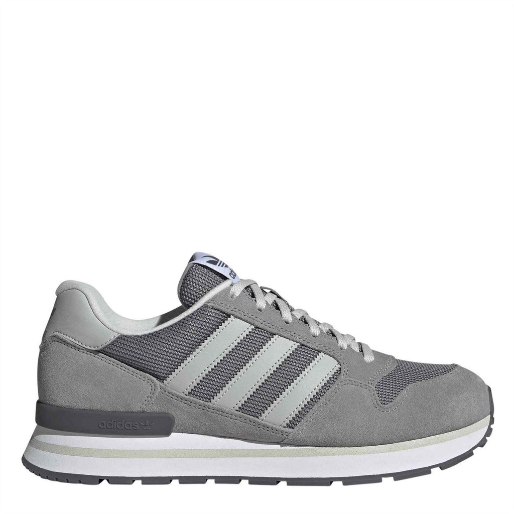 Grey suede-look lace-up sneaker with three white stripes and cushioned sole