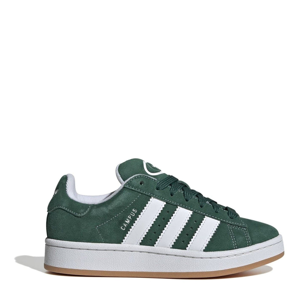 Juniors green suede trainers with three white side stripes, lace-up closure, low profile.