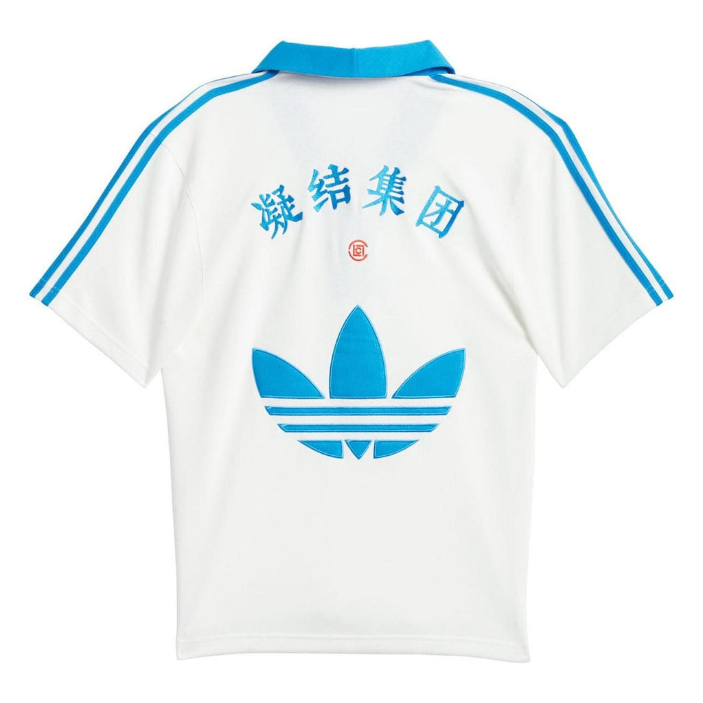 White polo with blue back characters, large blue trefoil logo, and blue side stripes