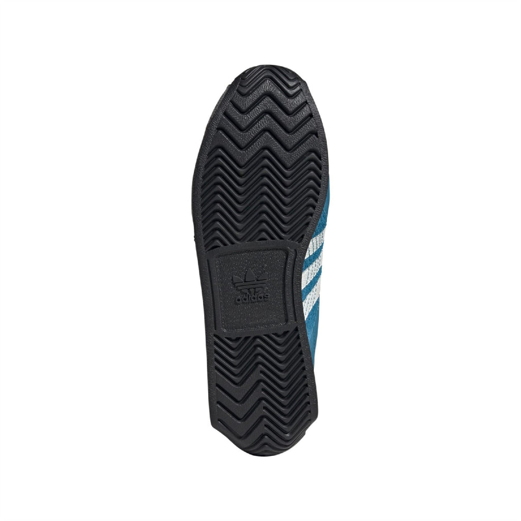 Rubber outsole for teal trainers, textured zigzag tread with adidas logo mark