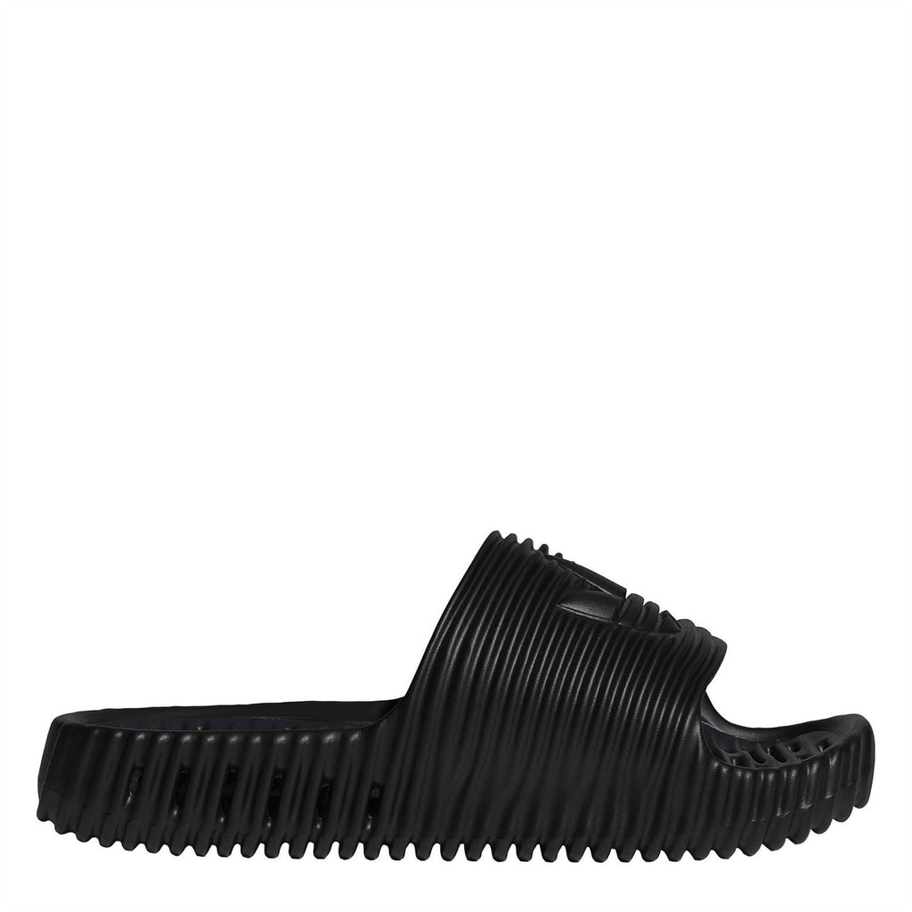 Core Black slide sandals with ribbed strap and ridged outsole, open toe