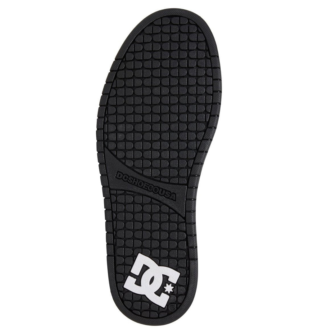 Black rubber outsole with grid tread pattern and DC logo on the heel