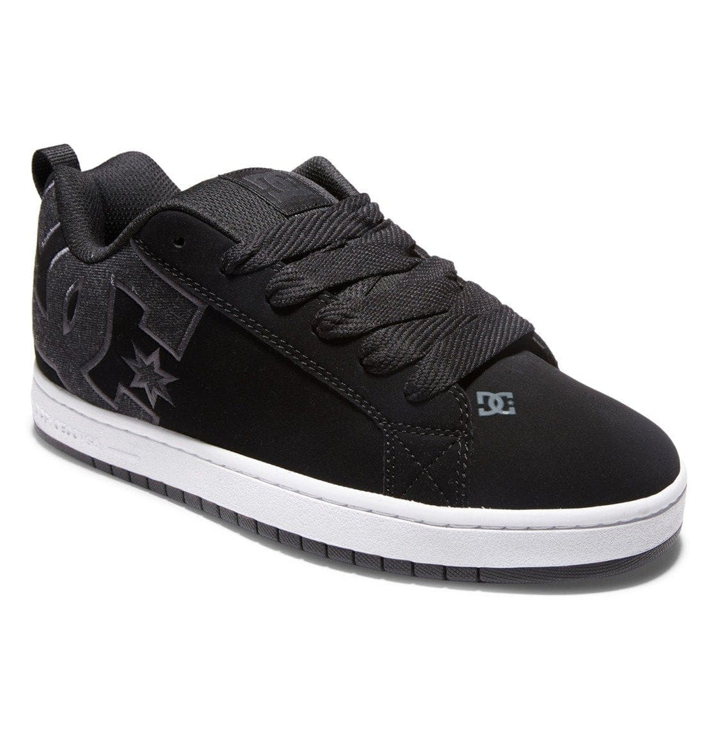 Black low-top sneaker with star logo, DC logo, and white midsole