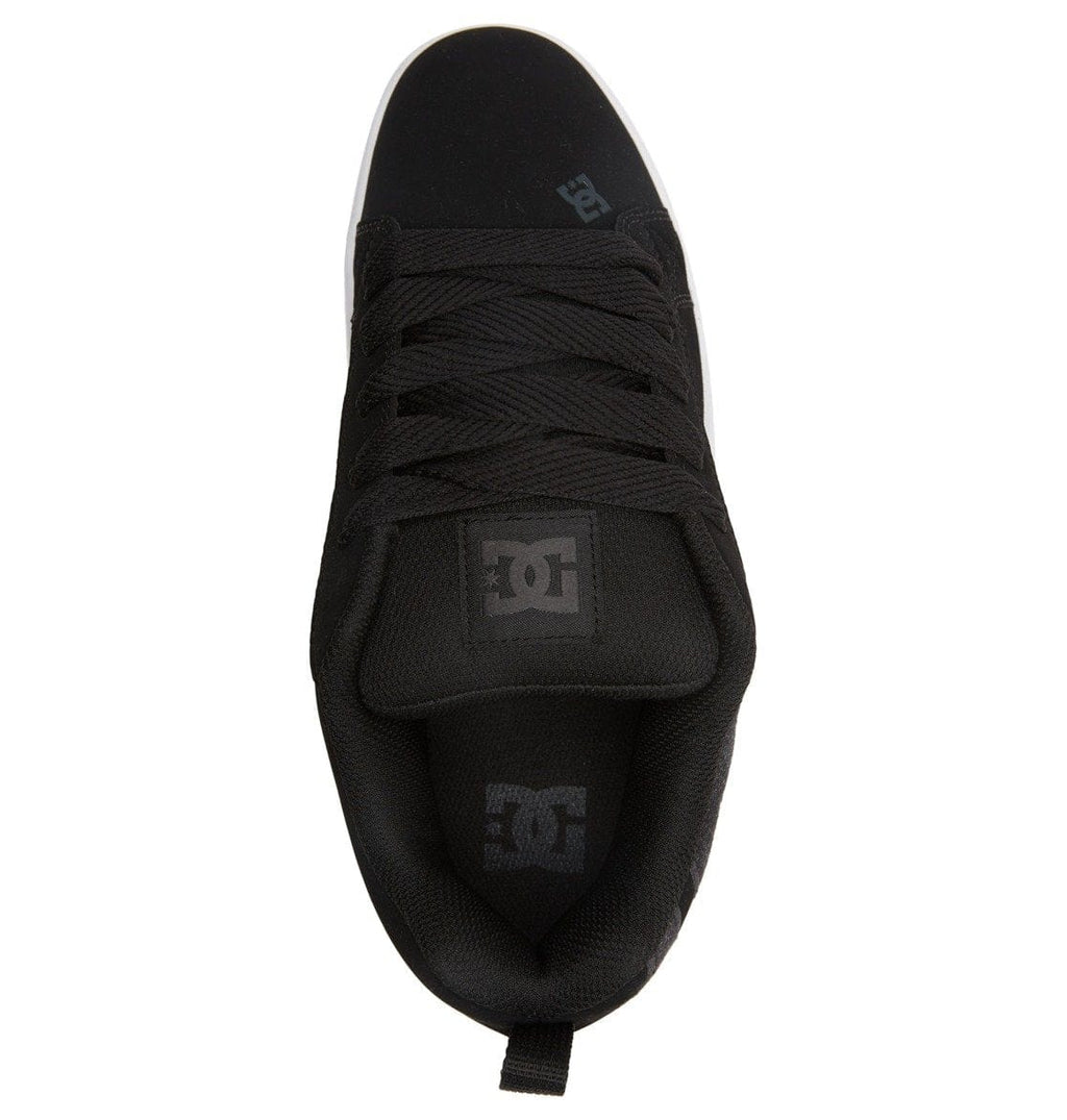 Black low-top sneaker with lace-up tongue and DC logo on heel area