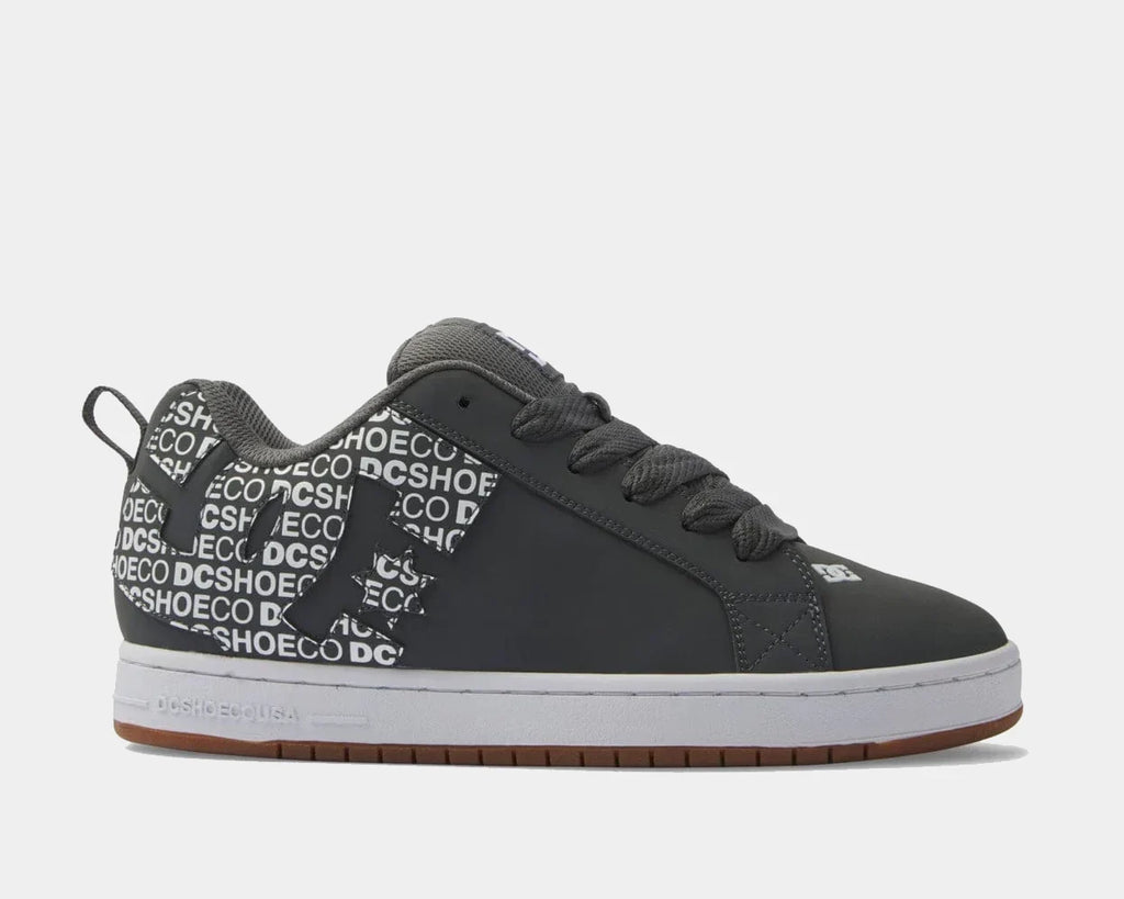 Dark grey low-top sneakers with patterned collar, lace-up front and DC side logo