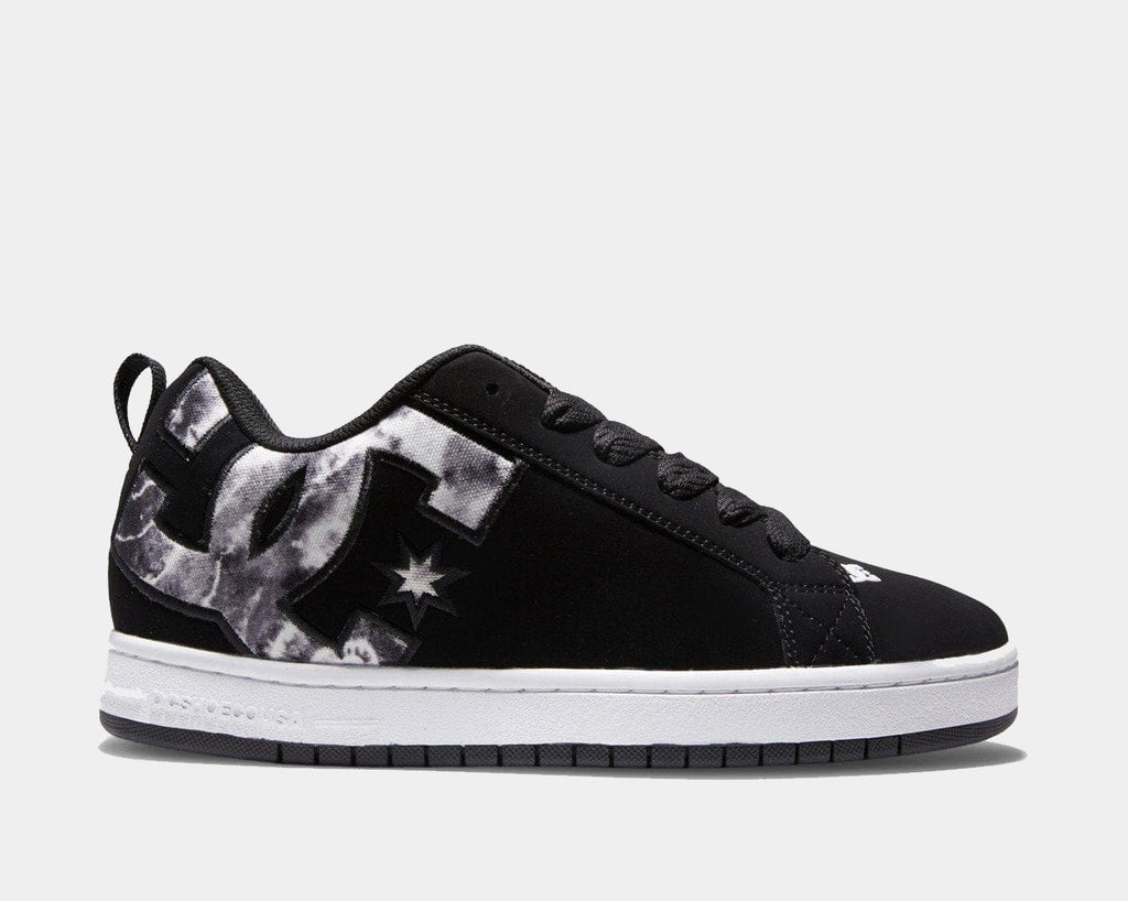 Black low-top sneakers with lace-up front, star graphic, and white midsole