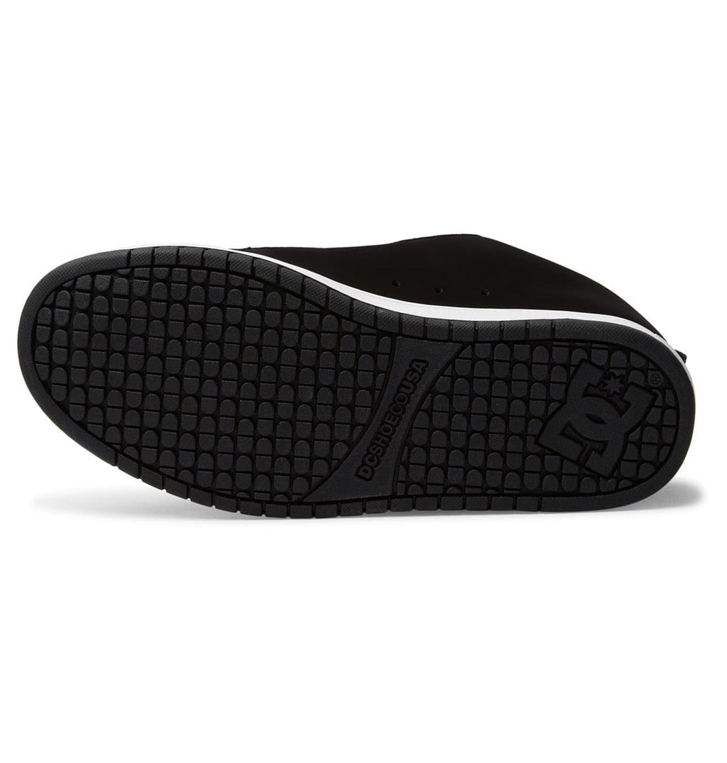 Black rubber outsole with textured grid tread and DC logo on heel