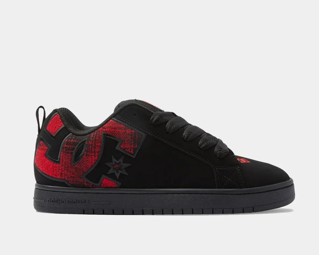 Black low-top sneakers with red graphic accents, star logo, and lace-up design