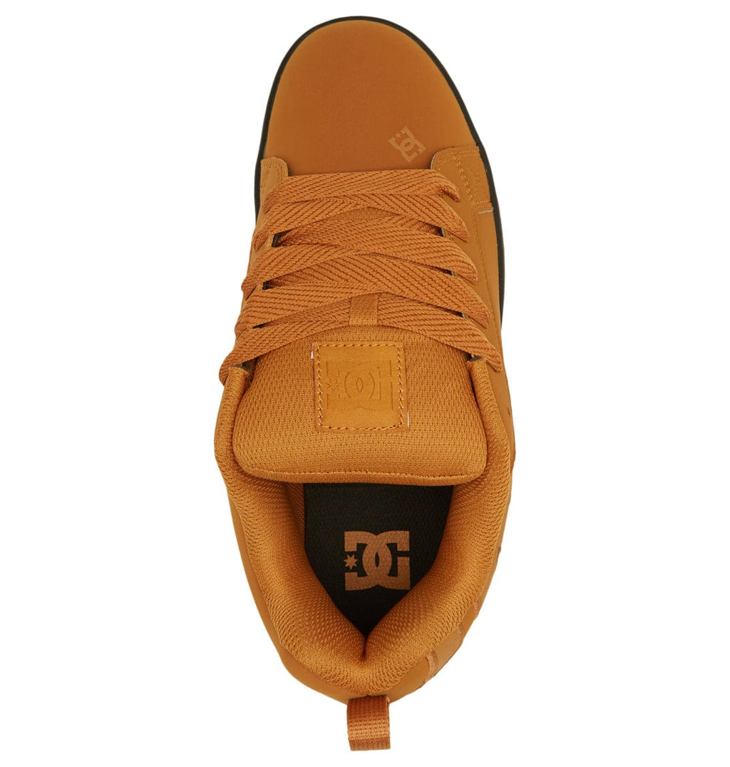 Tan/orange low-top sneaker showing laces, tongue label, and padded collar