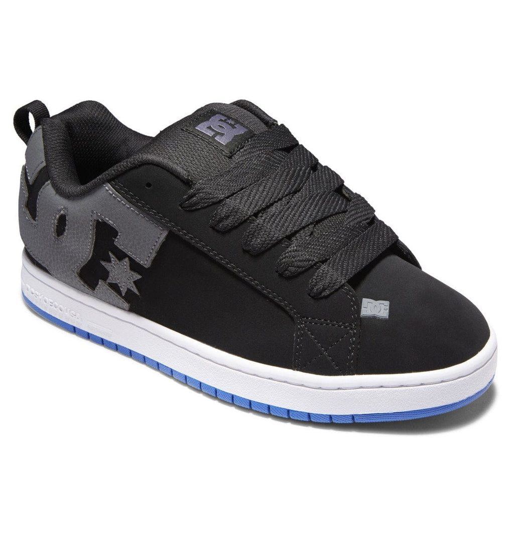 Black skate shoe with gray panels, star emblem, and white sole with blue edge trim
