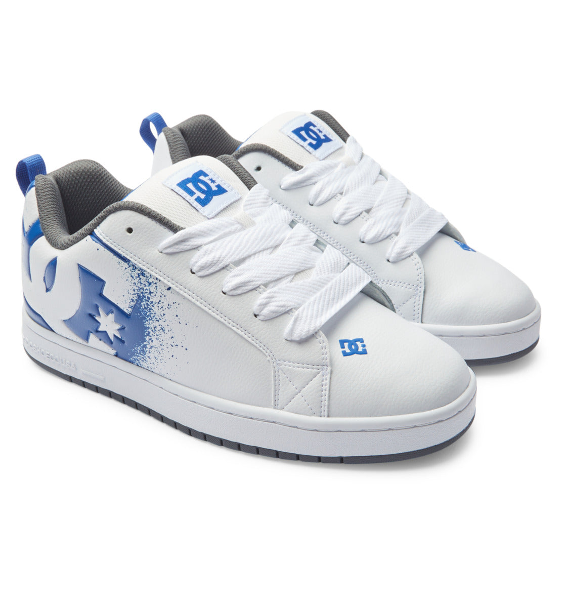 White low-top sneakers with blue accents, white laces, black rubber sole