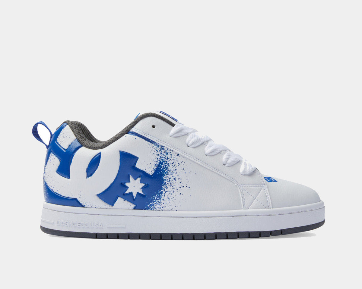 White low-top sneakers with blue DC logo and speckled panel detail