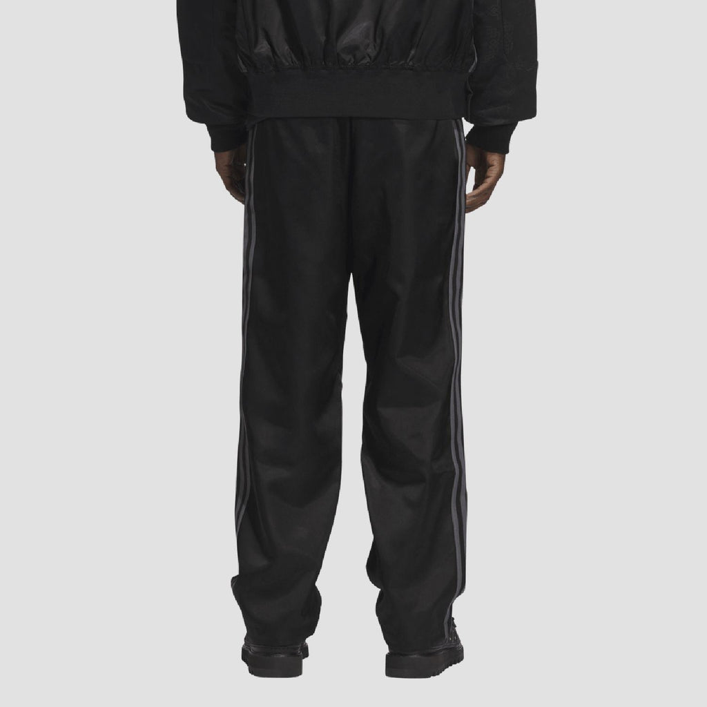 adidas Originals black tracksuit bottoms with elastic cuffs and side seam detail