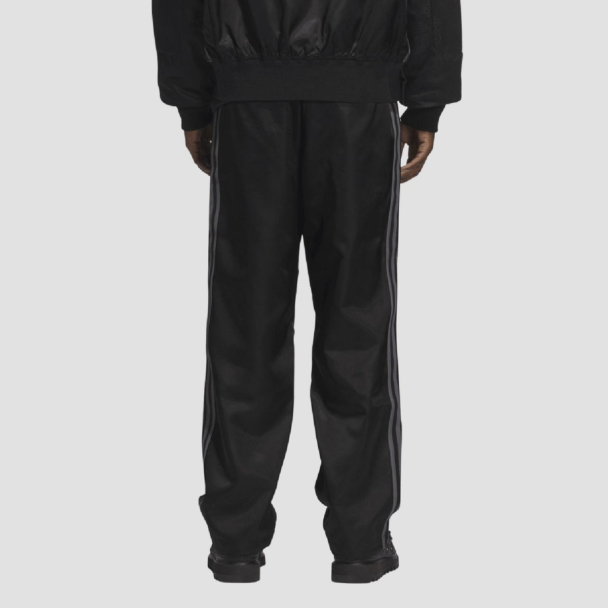 adidas Originals black tracksuit bottoms with elastic cuffs and side seam detail