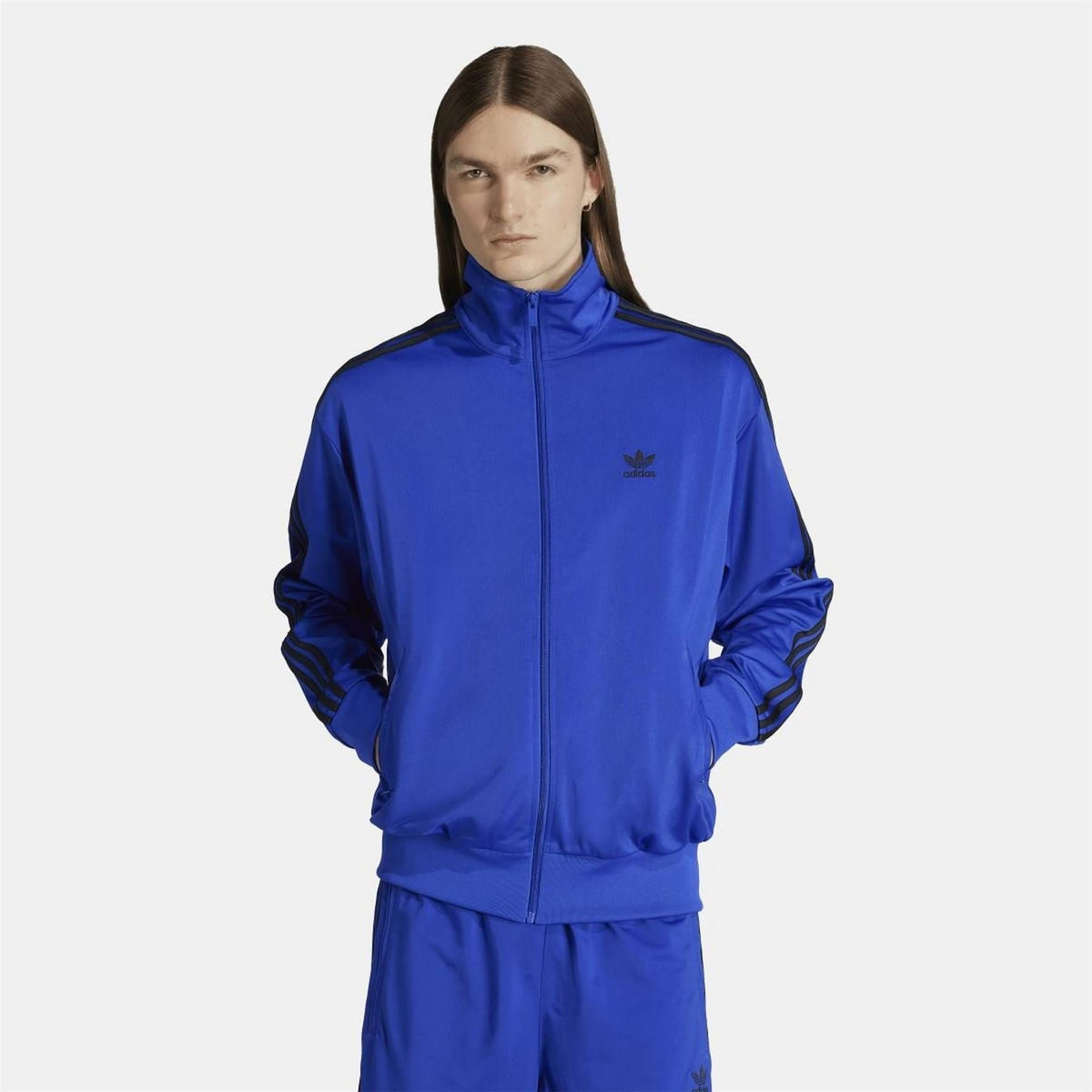 adidas Originals Classics Firebird track top in black with white stripes, showcasing the iconic retro sportswear design.
