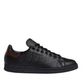 Black leather-look Stan Smith-style trainers with brown heel tab and lace-up front