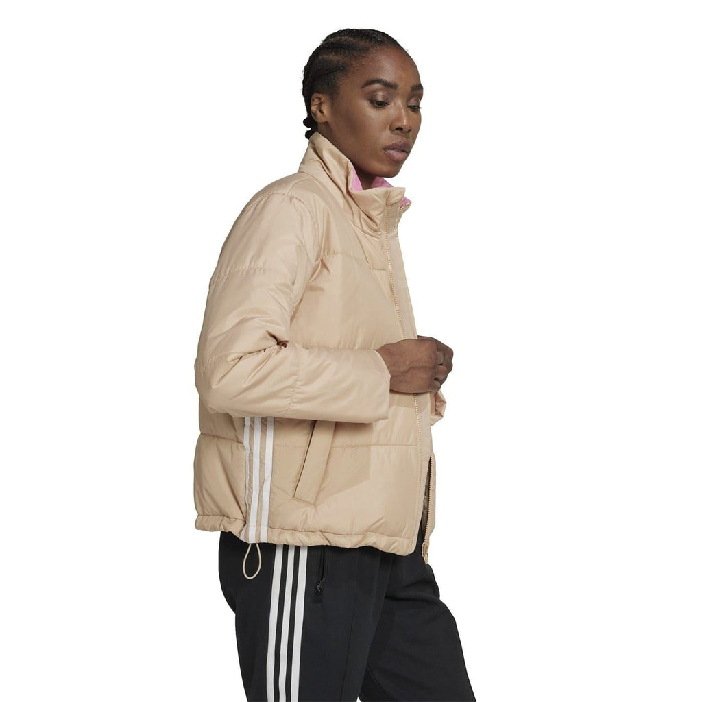 Beige padded high-neck zip jacket with long sleeves and elastic cuffs.