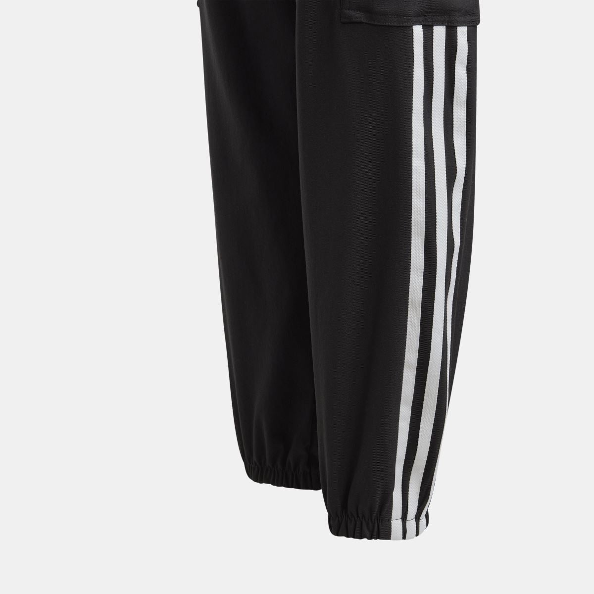 Black kids jogger trousers with white adidas-style triple stripe side panel and elastic hem