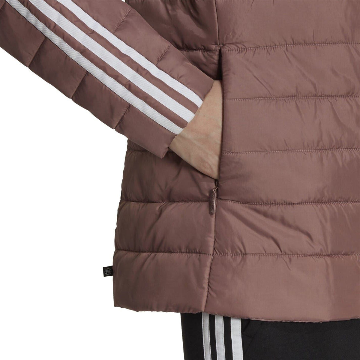Short puffer jacket close-up with striped sleeve detail and full-zip front