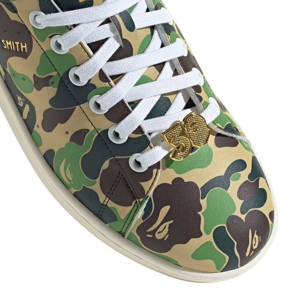 adidas Originals Bape Stan Smith shoes featuring white leather uppers, green accents, and classic sneaker design.