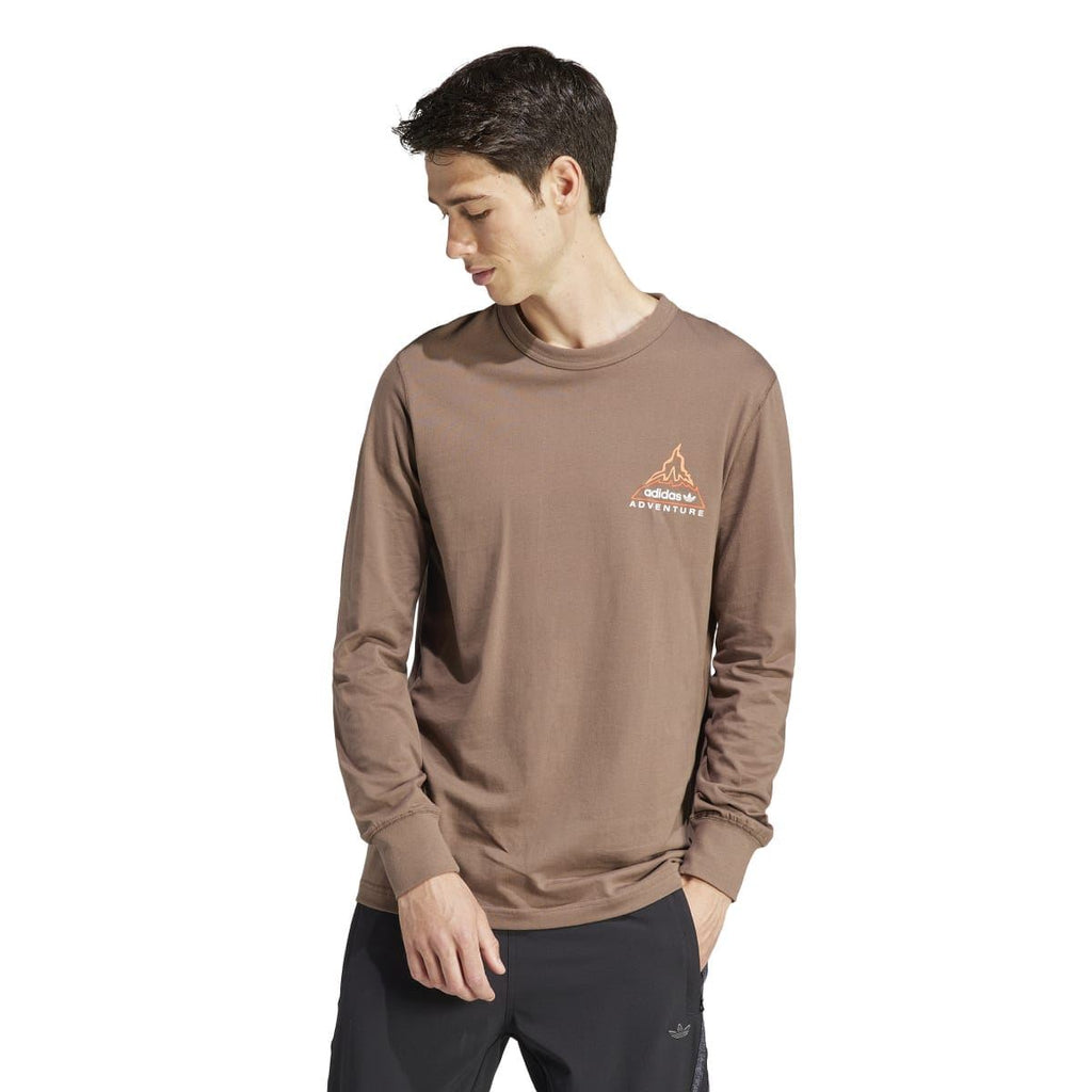adidas Originals brown long-sleeve T-shirt on model, crew neck, chest adventure graphic
