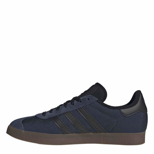 Gazelle OG lace-up sneakers with navy/black mesh uppers, three stripes, and brown gum sole