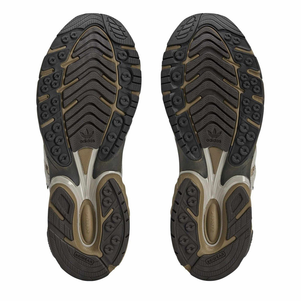 Low-top walking shoe outsoles with patterned tread and embossed branding