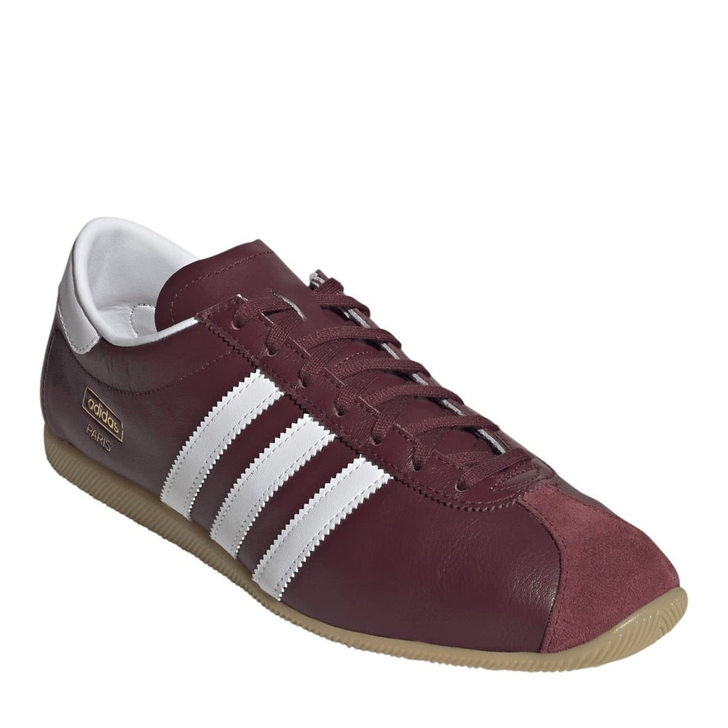 Burgundy lace-up low top sneakers with white stripes and textured gum sole