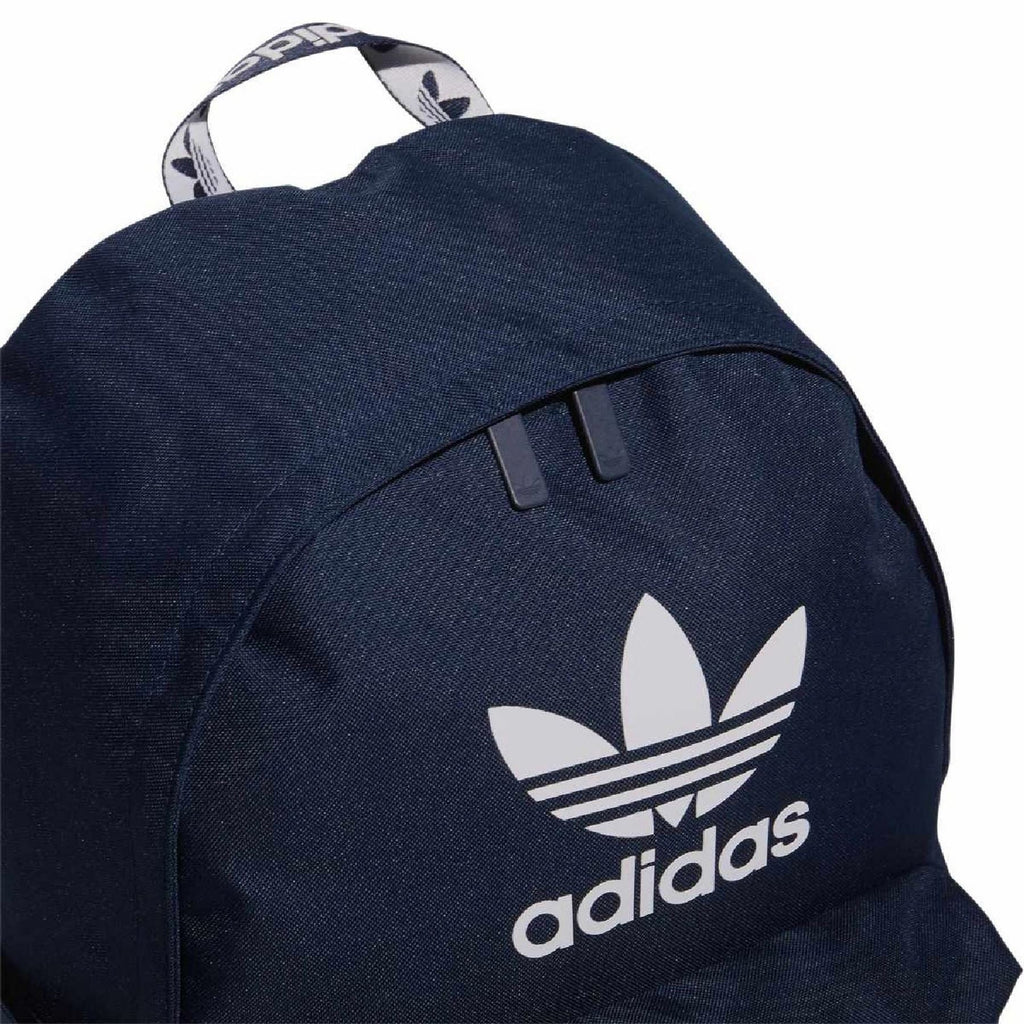 Dark indigo backpack close-up with adidas logo on the front