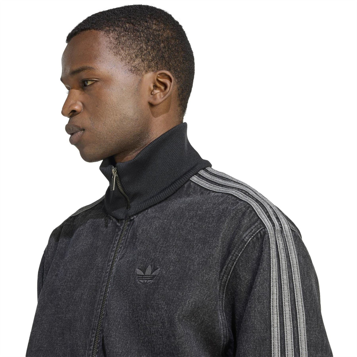 Mens black denim jacket close-up with adidas logo, high collar, and zip placket