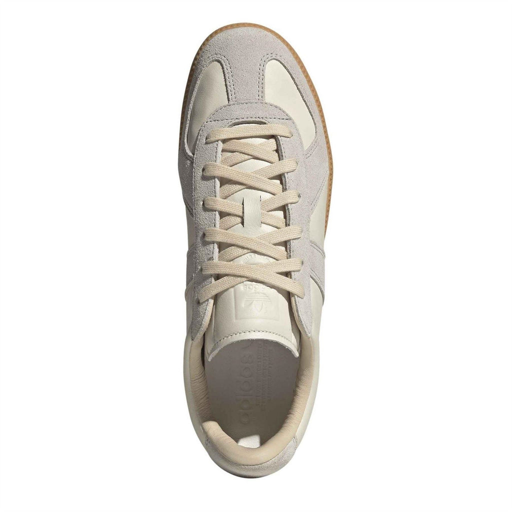 Cream and gray lace-up sneaker with visible tongue and padded interior