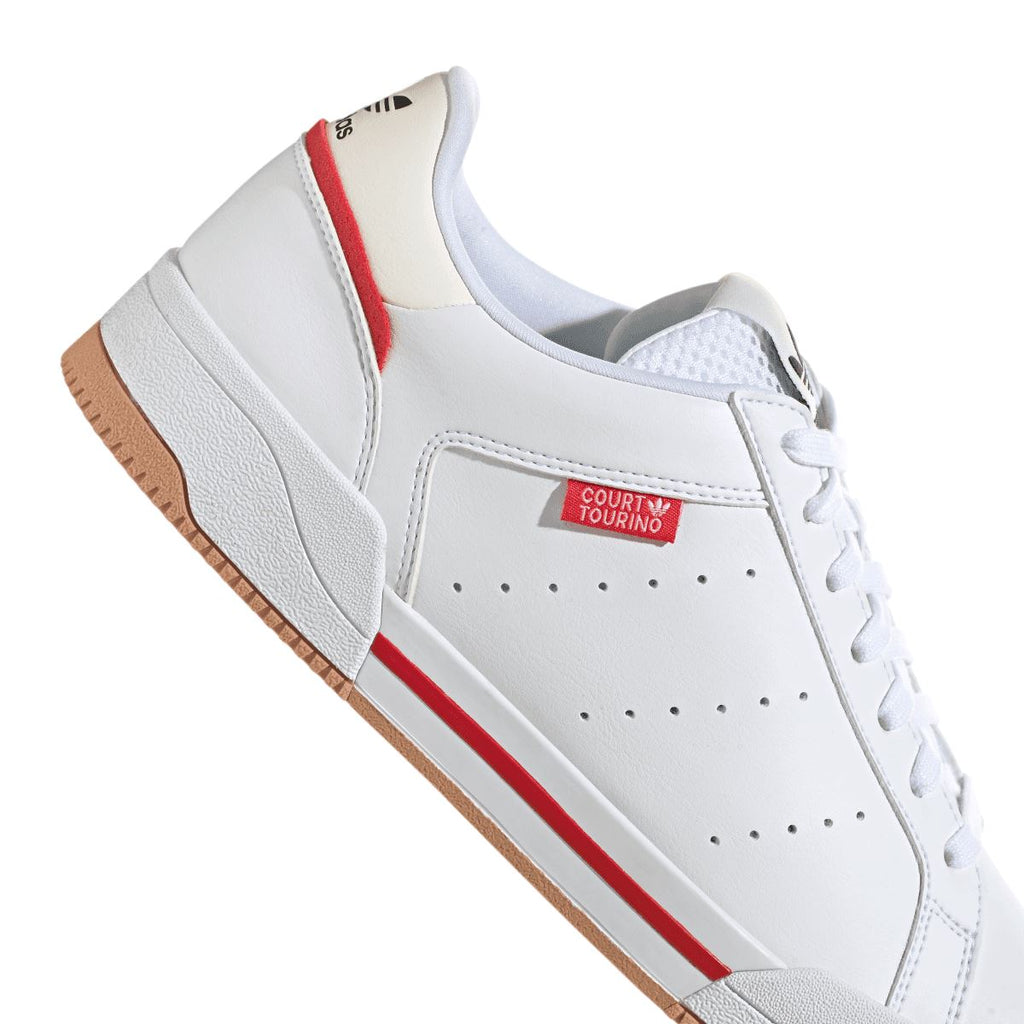 White trainers with red stripe, perforated toe, and COURT TOURINO badge