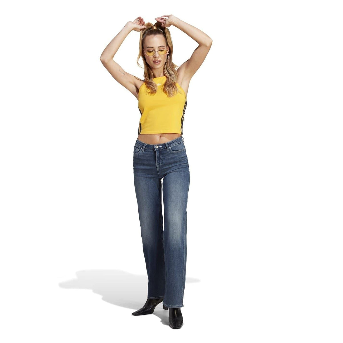 Yellow adidas cropped halter tank top with navy side stripes and tie neck