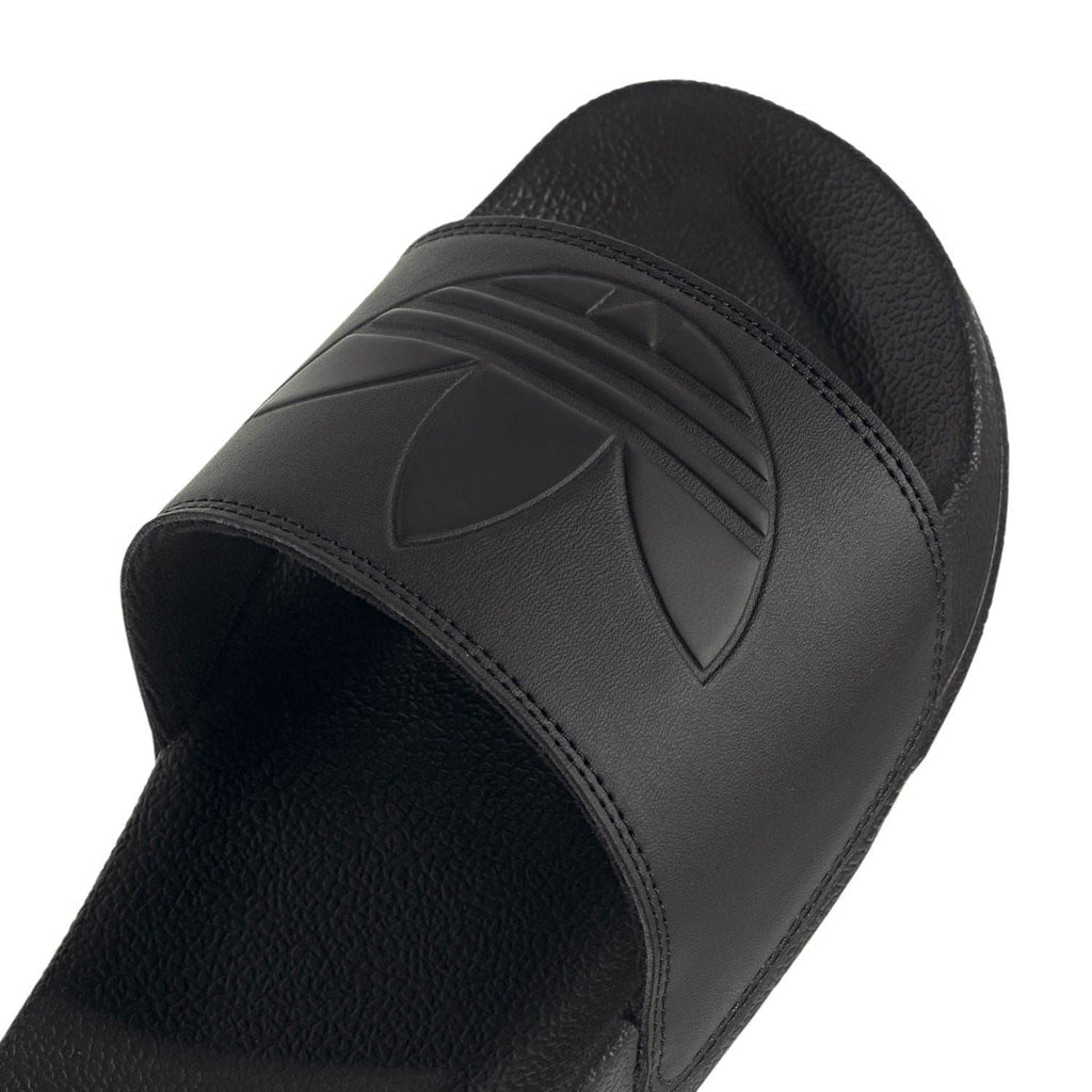 Black molded strap featuring adidas three-stripe logo and curved stitching
