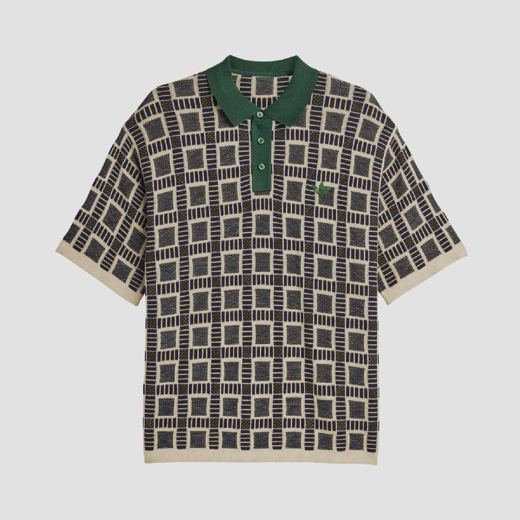 Sand polo shirt with green collar and button placket; navy-and-cream grid pattern.