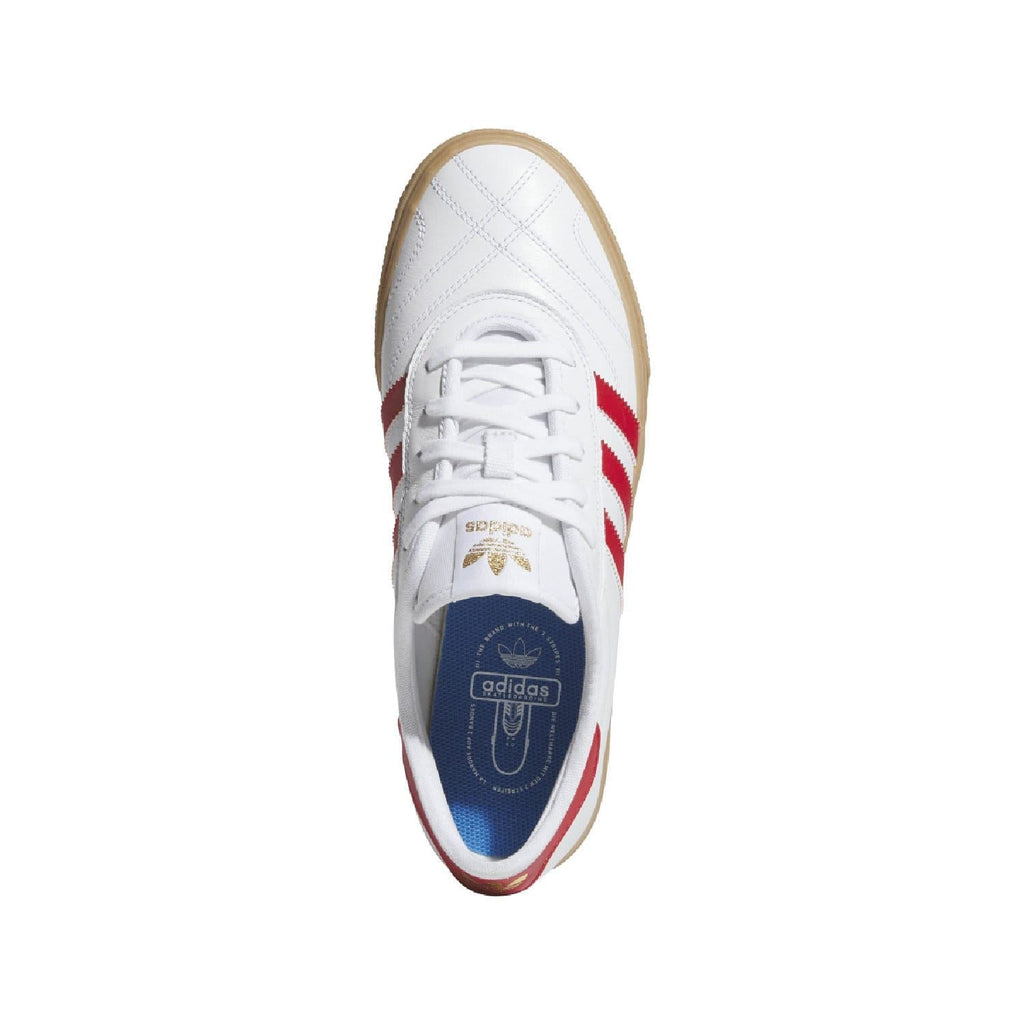White adidas Adiease trainers viewed from the side with red stripes and tan sole