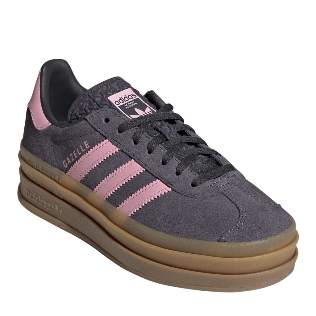 Dark gray Gazelle Bold sneakers with pink stripes, lace-up front, and tan cupsole