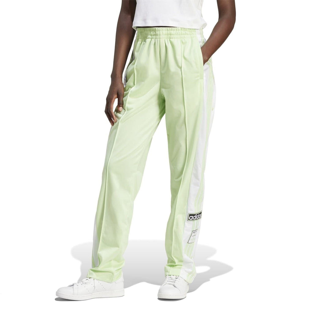 Light green track pants with tapered legs and contrast side stripes