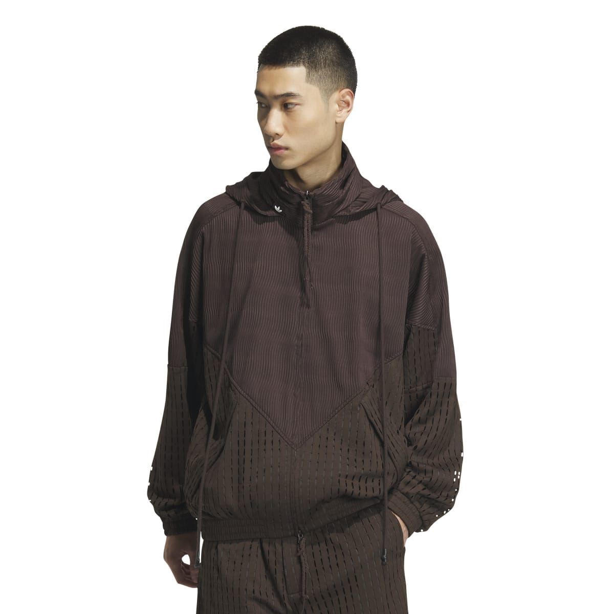 Brown zip-up hooded jacket with textured perforated chevron pattern and elastic cuffs