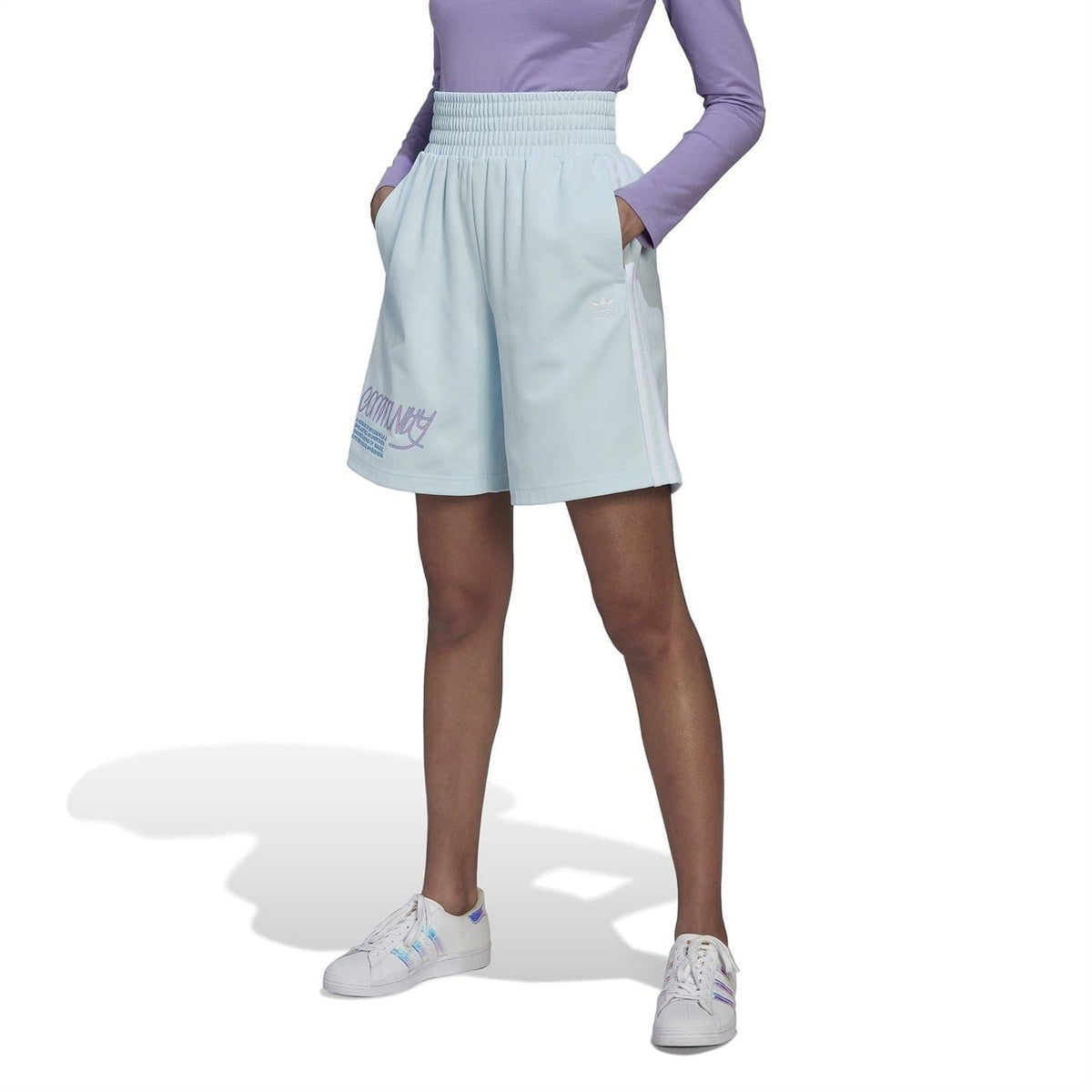 Light blue athletic sweat shorts with elastic waistband and side trefoil logo, knee-length