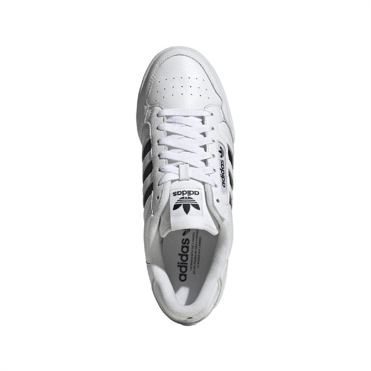 White adidas low-top trainers with perforated toe, white laces, and side stripes