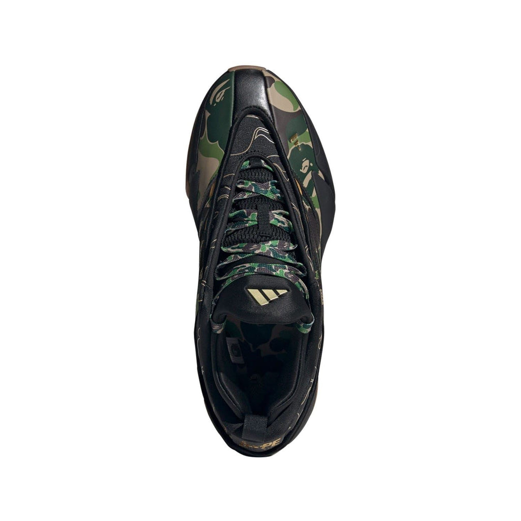 Black trainer with camo panel and lace-up closure, side view