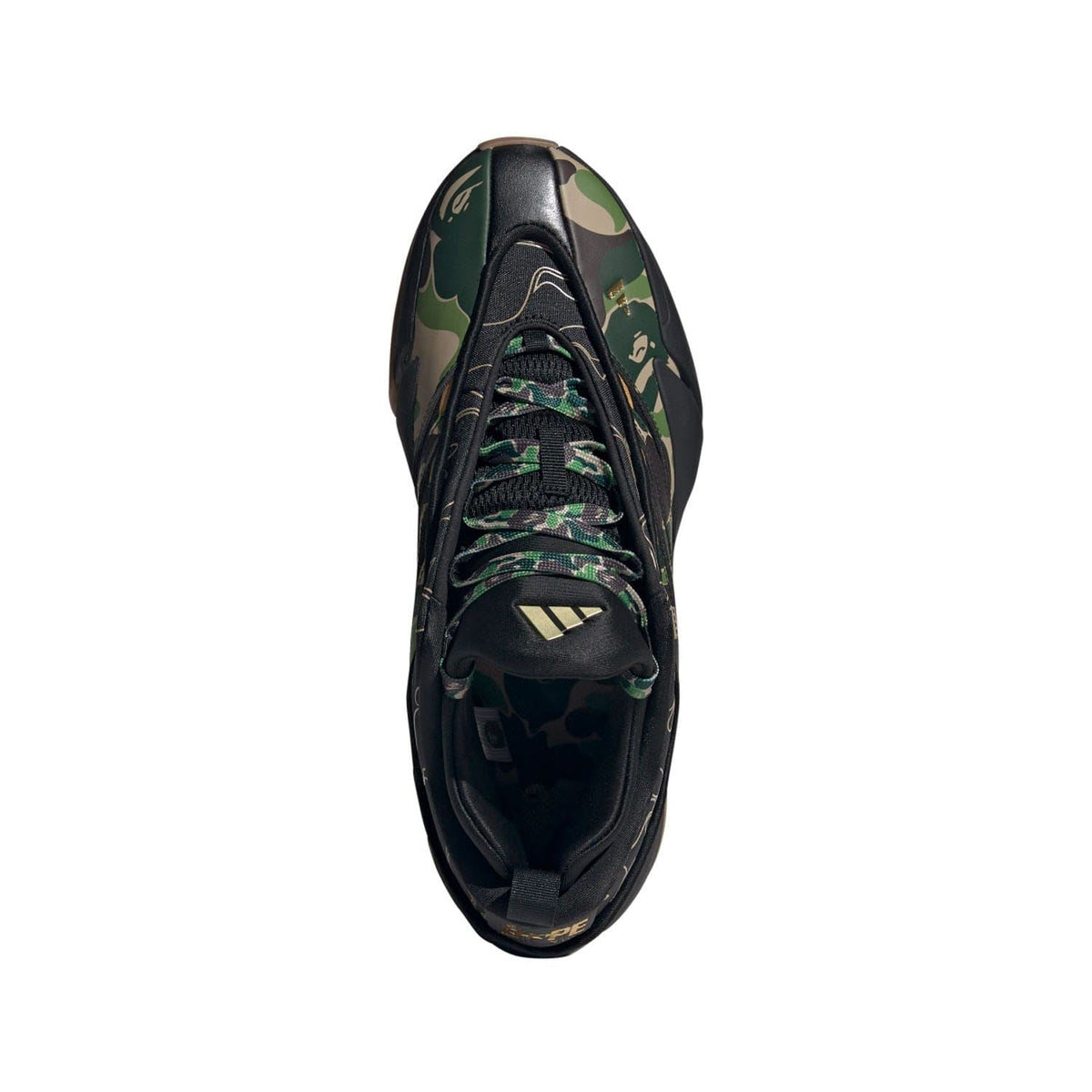 Black trainer with camo panel and lace-up closure, side view