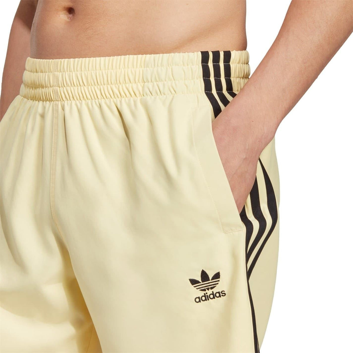 adidas Originals Ori 3 Stripes swim shorts showing blue fabric with iconic three-stripe design and elastic waistband