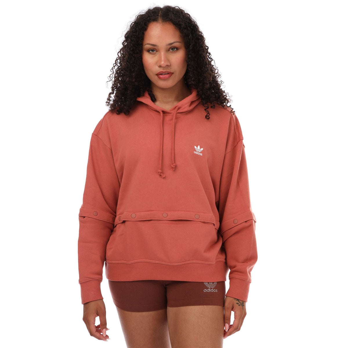 Pink adidas Originals hoodie with hood drawstrings, snap-button placket, trefoil logo