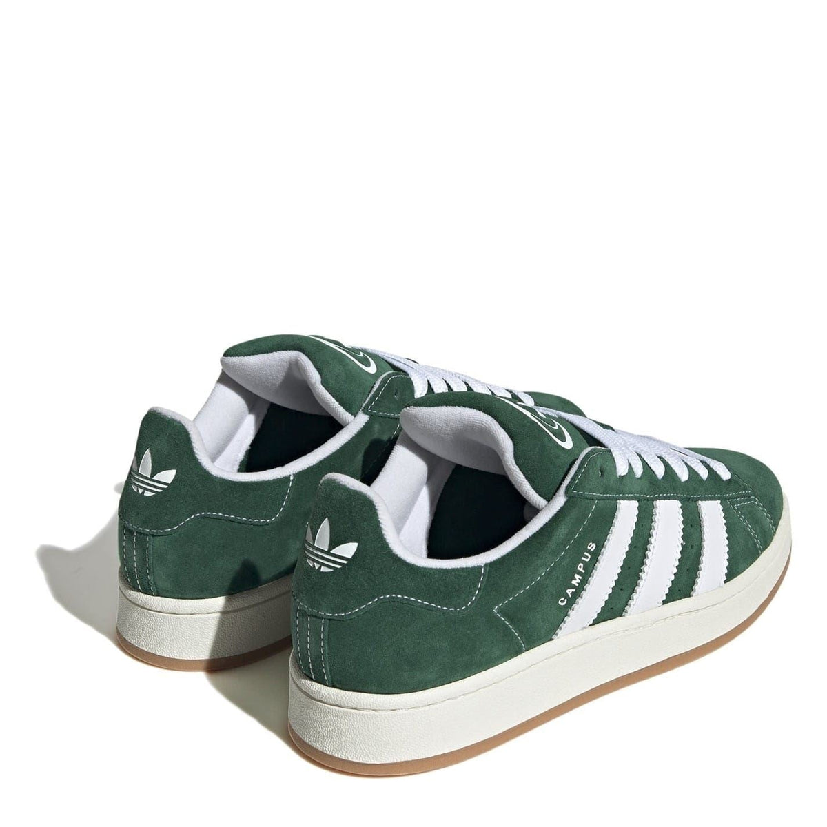 Green suede sneakers with white three-stripe detailing, lace-up design, gum sole