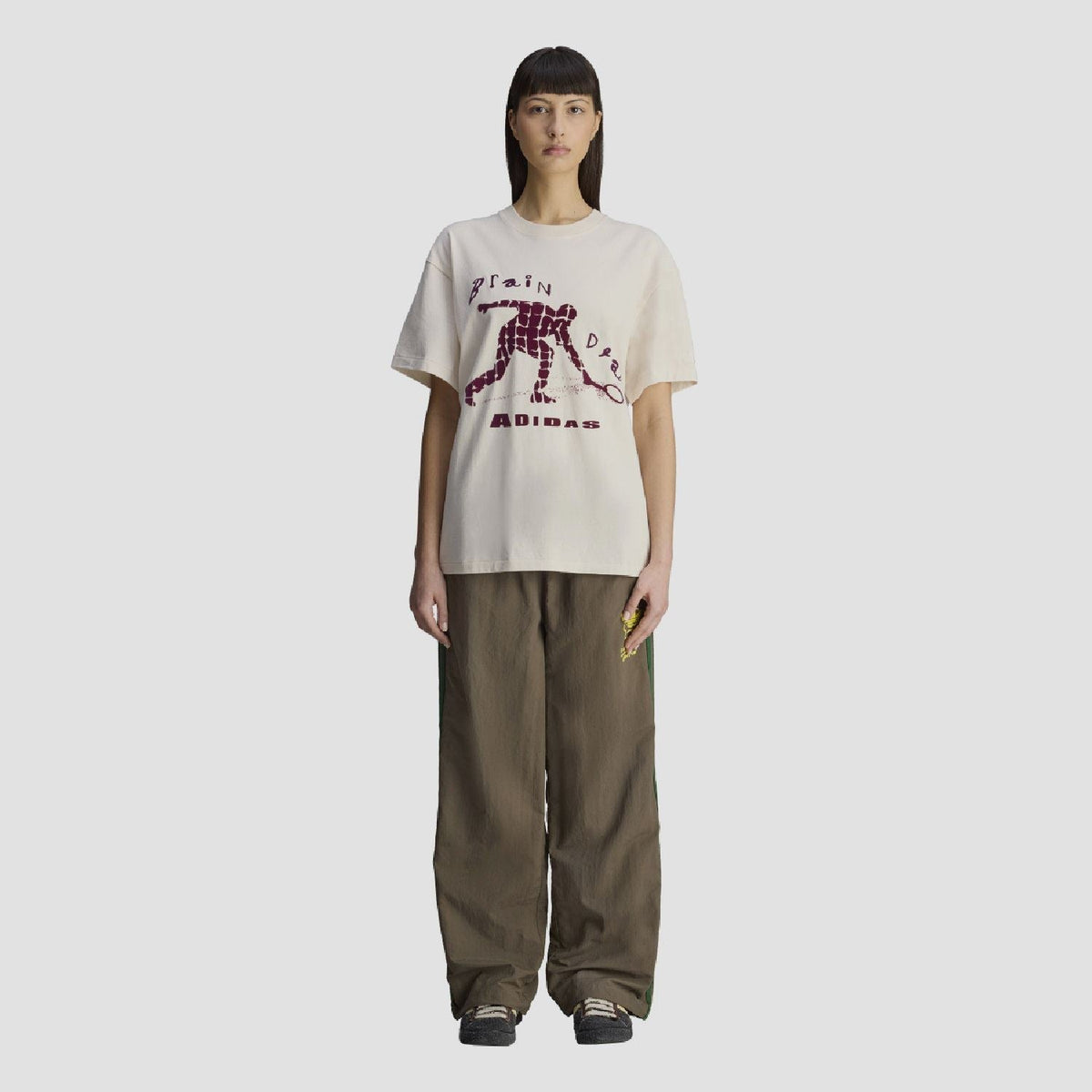 Chocolate track pants with elastic waist, green side stripes, straight wide fit